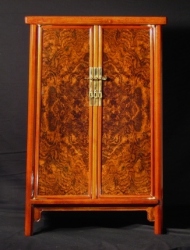 Round-corner cabinet with walnut burl doors. By Bruce Powell