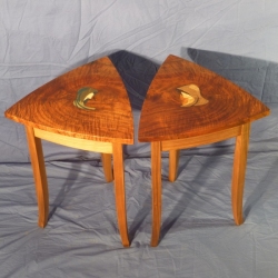 A pair of tables titled "Stolen Looks - Hidden Love" by Bruce Powell