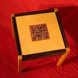 A side table with an inlaid QR code expressing an interesting quotation.  By Bruce Powell