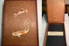 Treasure box, body of bubinga wood, lid of lacewood with inlaid colorful koi fish, by Bruce Powell
