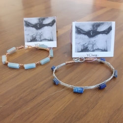 Bracelets by Jane Y. Chang. Left is Sunset Lakes of copper and Amazonite. Right is Haybales of silver and Lapis.