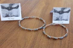 Bracelets by Jane Y. Chang. Both named Fire and Passion.  Left is large, right is small size.