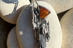 Necklace of Sterling silver with Oregon Sunstone on leather, by Judy Dailey