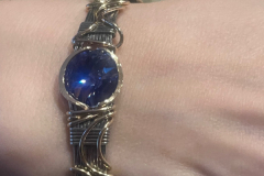 Bracelet of Sterling silver and goldfill wrapped Swarovski crystal  by Judy Dailey