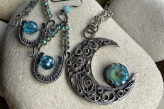 Earrings and necklace of Sterling silver with aqua Swarovski crystals, by Judy Dailey