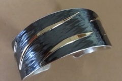 Hammered silver bracelet w 18k overlay by Michael Borofka