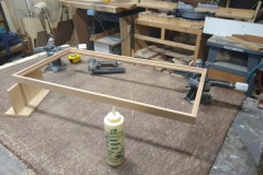 Norm using his woodworking skills to create a custom frame