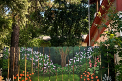 Camouflaged Fence by Trixie Hollyhox, mural